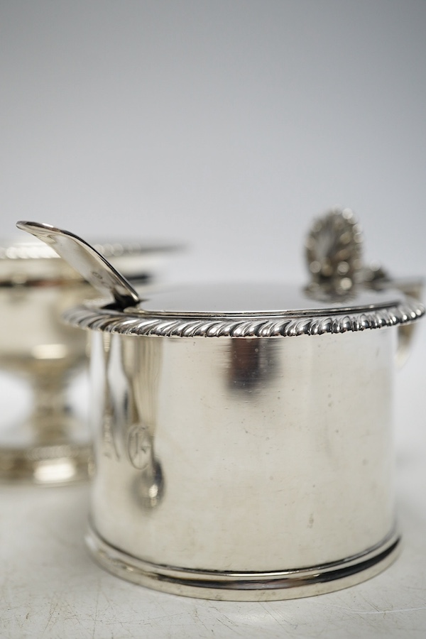 A pair of George III silver salts, London 1799, 240g, a George IV silver mustard pot, London 1822, 116g, a Victorian silver drum mustard pot, by Edward John and William Barnard, London 1850, four various mustard ladles (